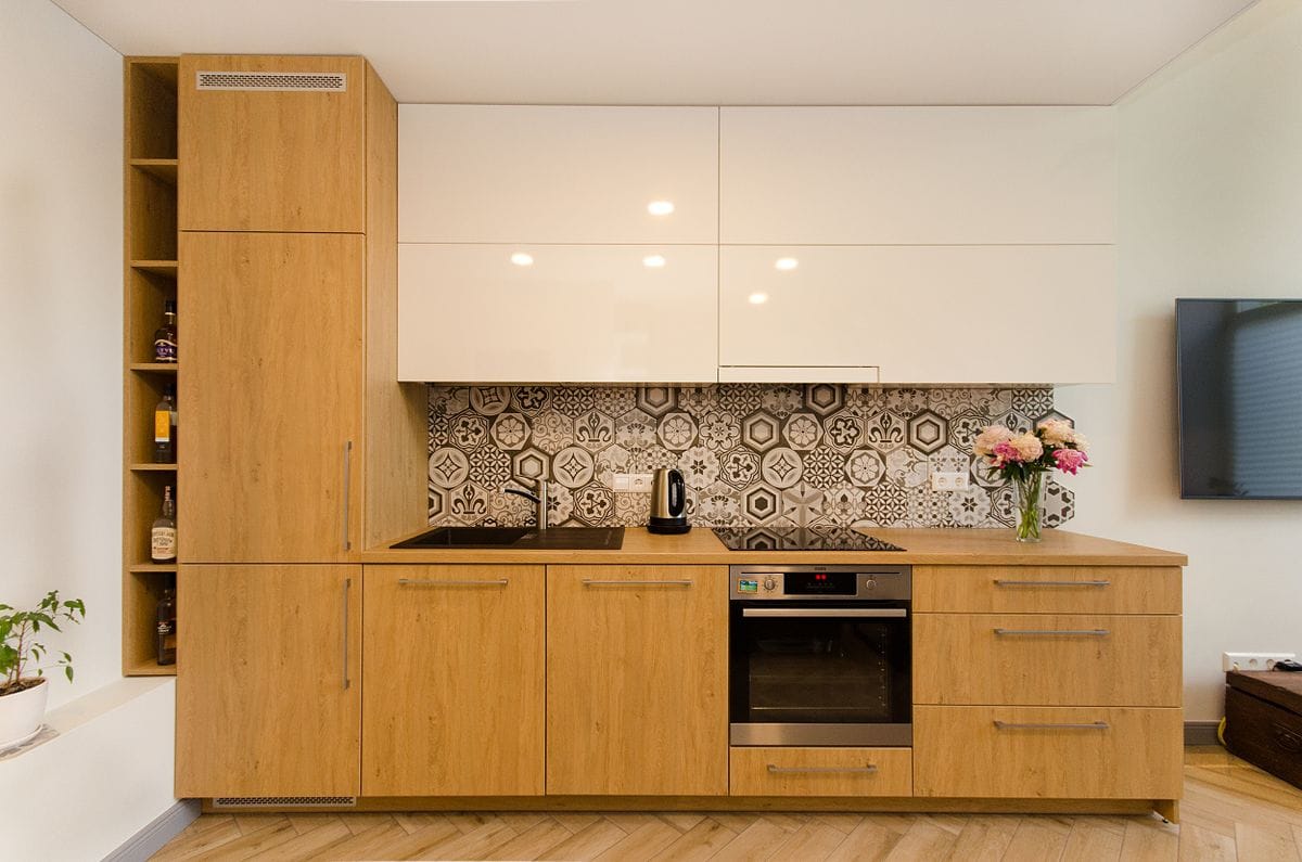 Modern kitchen with wooden cabinets and a patterned backsplash