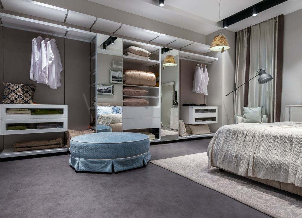 Bedroom with a fitted wardrobe wall and shelving